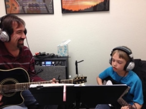 Nick and I in studio at Spotlight Music in front of music stand